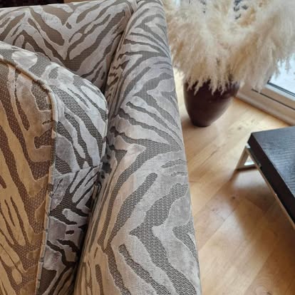 Upholstered armchair after cleaning, fabric restored